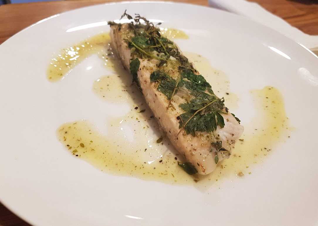 Salmon with lemon, herbs, garlic and butter