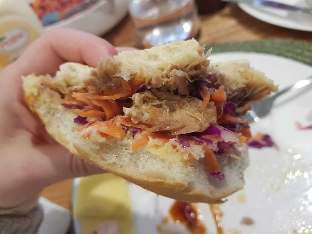 bun with pork, coleslaw, cheese and butter